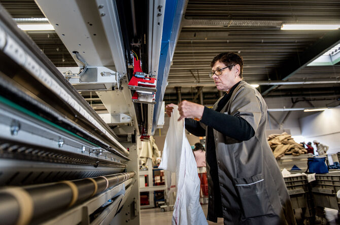 ENTRA blanchisserie industrielle traitement du linge plat calandre drap