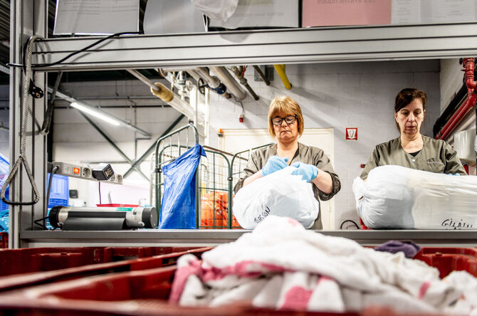 ENTRA Blanchisserie industrielle traitement du linge plat tri du linge